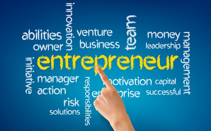 Hand pointing at a Entrepreneur word illustration on blue background.